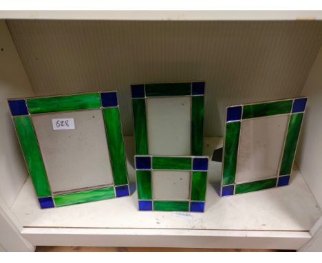 Shelf of decorative picture frames. 