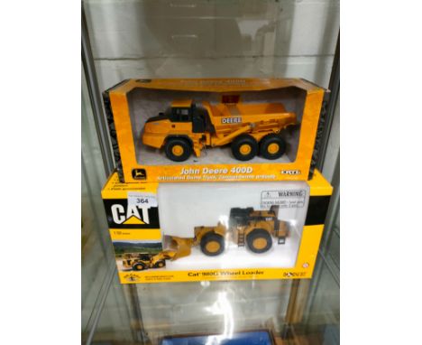 Boxed CAT tractor model together with john Deere dumper truck . 