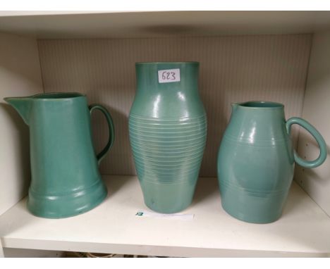 Shelf of early Buchan pottery jugs etc . 