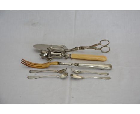 A bone handled ham bone holder, a white metal handled three tine fork with star decoration and a pair of plated cake servers.