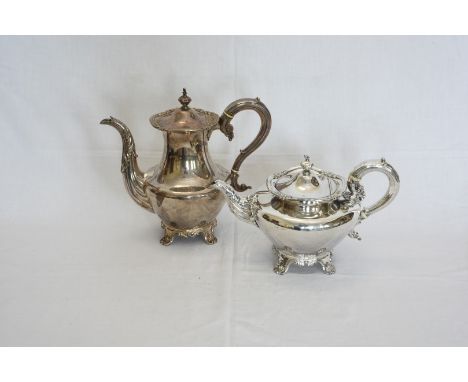 A plated teapot and coffee pot with scrolled handles, floral and scroll carved rims, acanthus leaf cast spouts and raised on 