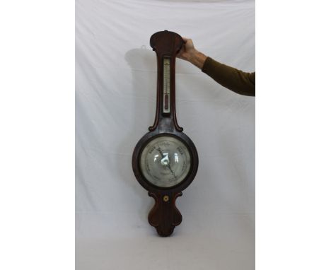 A 19th century rosewood cased banjo barometer/thermometer with silvered back plate and retailers name Beha & Co Norwich with 