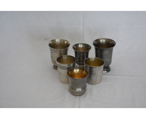 Six various French silver plated goblets, the first with fruiting vine scroll decoration and initialled centre, the second in