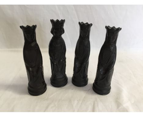 A set of four Wedgwood Black Jasperware chess pieces comprising three black queens and a black king.  