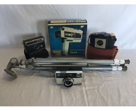 A Mirage zoom super VIII cine camera in original box together with a tripod, a Kodak Brownie 127 camera in canvas case and tw