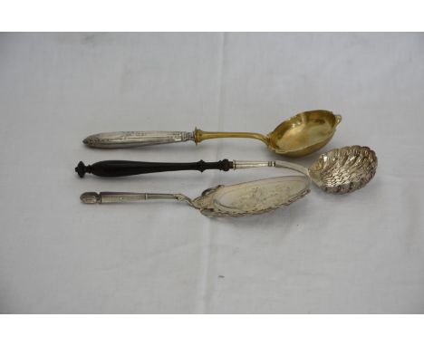 A continental silver plated sifter spoon with pierced shell form bowl and turned ebonised handle, a continental serving spoon