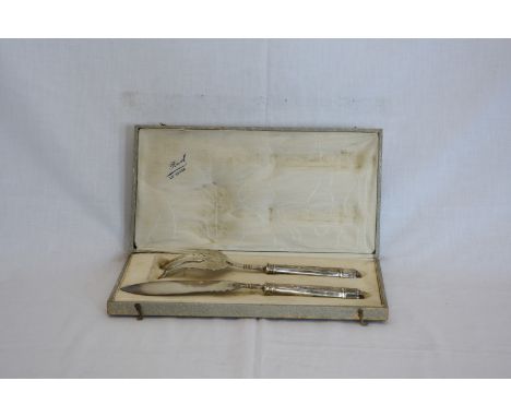 A French silver fish serving set comprising fork with out-splayed tines and knife with harebell decorated blade and swag deco