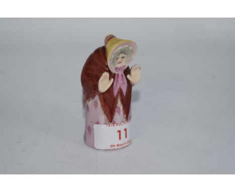 A Royal Worcester 'Granny' candle snuffer. AF.