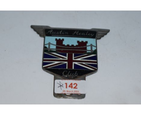 An Austin Healey Club car badge.