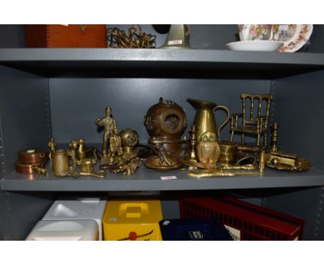 A large collection of vintage brass collectables, including miniature rocking chair, replica diving helmet, figurines, etc.