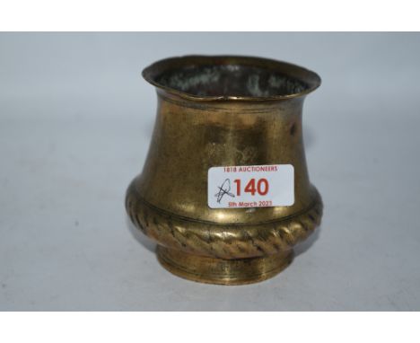 An Ankhora or ritual holy water pot of squat form in bronze or bronze effect metal, with rope like effect to middle and havin
