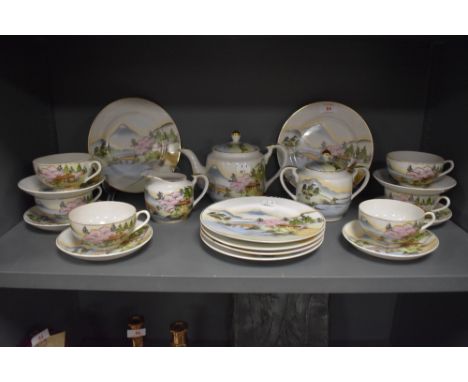 A selection of Japanese Lithopane egg shell tea wares, comprising cups and saucers, plates, tea pot, jug and sugar basin.