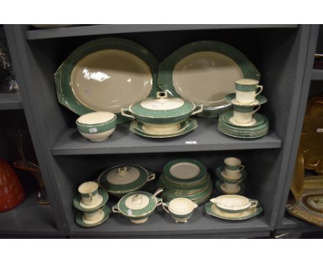 A collection of Art DEco J and G Meakin 'Florida Sol' dinner service, having cream ground with mottled green banding and gilt