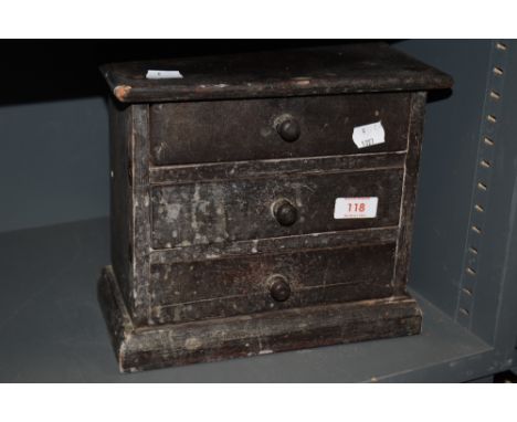 A vintage set of three drawers made from cigar boxes.