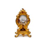 Wiener Miniatur-Tischührchen, 19. Jh., Bronze, vergoldet, mit 4 Granatcabochons, feine