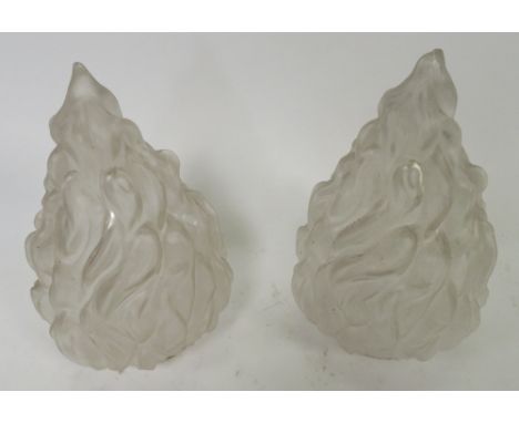 A matched pair of moulded glass lamp shades, modelled as flames, circa 1930's, 25cm high