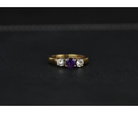 An amethyst and cubic zirconia three stone ring, finger size K, 2.2 g gross