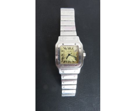 Cartier, Santos, a stainless steel automatic bracelet watch, the signed dial with Roman numerals, black hands and sweep secon