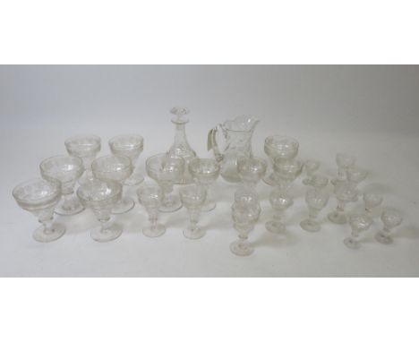 A suite of early 20th Century glass with cut and etched fruiting vine decoration comprising decanter and stopper; jug and a s