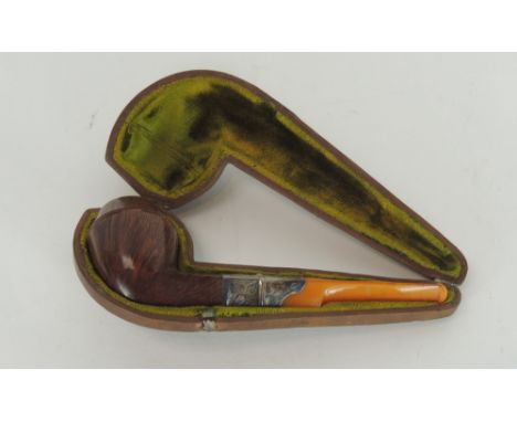 A George V briar pipe with engraved silver band & amber mouthpiece in original velvet lined leather case, hallmark London 191