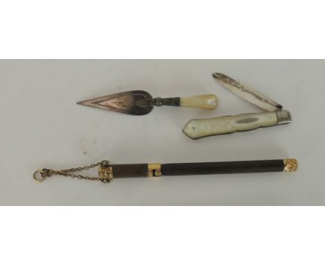 A late Victorian dip pen with original cover, suspension chain & with embossed gold metal mounts; a small silver & mother of 