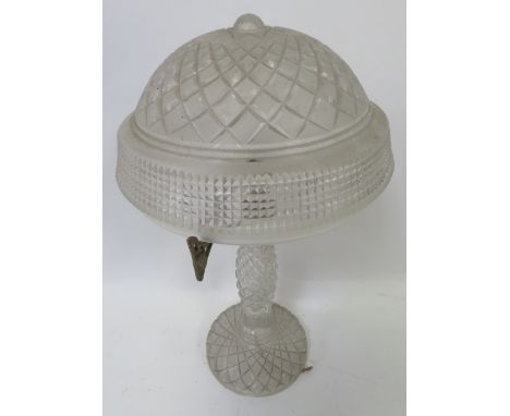 An early 20th Century cut glass table lamp with domed cut shade on original gilt supports & cut stem above circular base, app