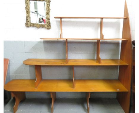 A set of circa 1960's light wood graduated shelves with sail shaped support to one side 195cm high max, 216cm wide max