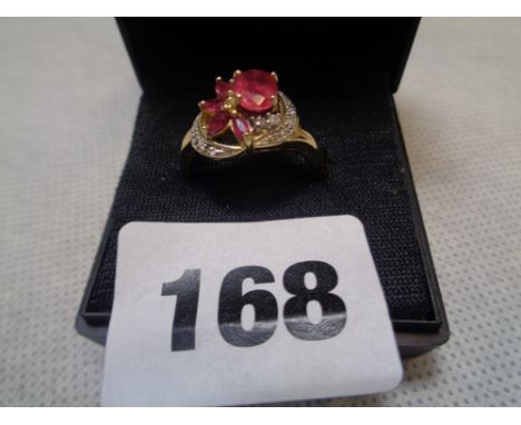 1970s Fancy Oval Ruby & Diamond Cluster ring set on 14kt Shank, 4g total weight Condition – Good Overall 