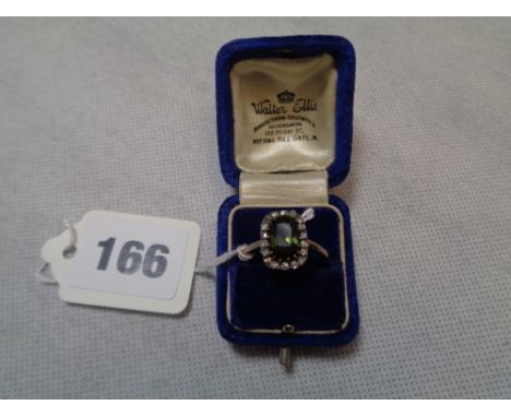 Late 19thC Oval Green Tourmaline (1.5ct Estimated) claw set ring with Rose Cut Diamond surround on Yellow metal shank, 5g tot