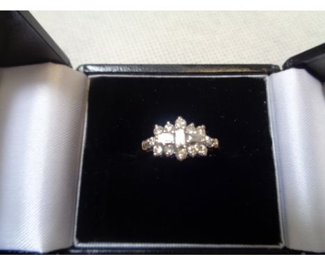 Ladies 18ct Gold 0.50ct Cluster Diamond Ring Set with Baguette and Brilliant Cuts, 3g total weight Condition – Excellent