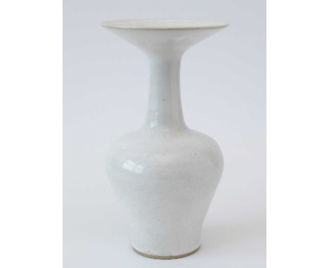 Lucie Rie (1902-1995). A large white glazed stoneware vase with flared trumpet neck, shouldered baluster body, covered in a t