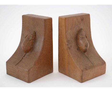 A matched pair of 'Mouseman' oak bookends by Robert Thompson, Kilburn, each with large carved mouse motif, each approximately