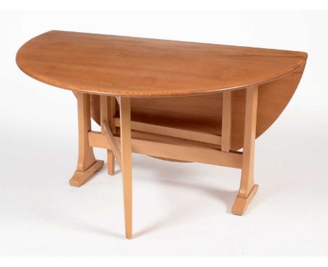 Ercol: an elm and beechwood drop leaf dining table, 140 (open) x 129 x 72cms high.