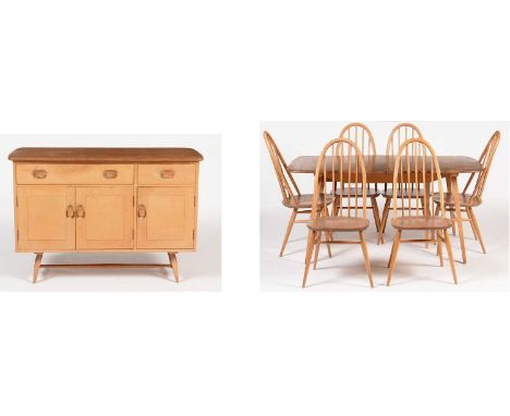  Ercol: a Windsor style sideboard, in elm and beech, fitted two drawers above a single cupboard, and another larger cupboard,