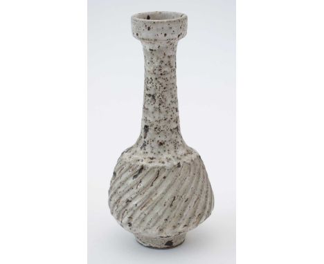Lucie Rie (1902-1995). A Stoneware mallet shaped Vase, matte pitted and speckled glaze, with circular 'garlic' shaped mouth, 