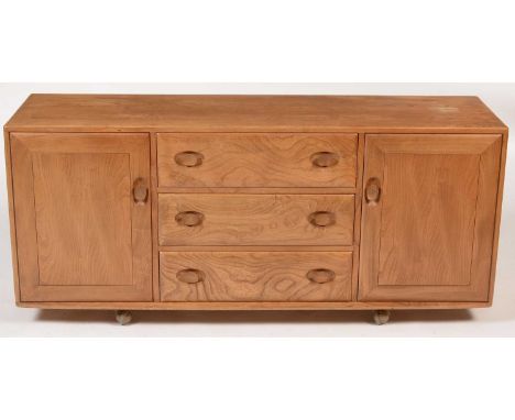 Ercol: a Windsor sideboard in elm, with three central drawers flanked by cupboards, the top drawer has a cutlery tray inside,