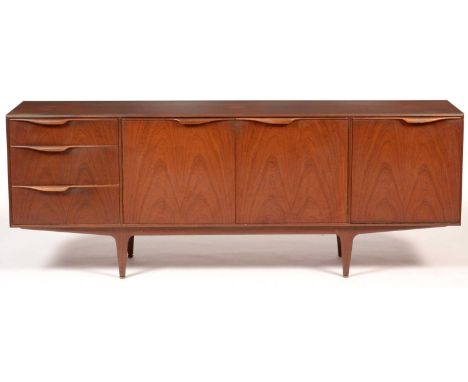 Tom Robertson for McIntosh of Kirkaldy: a 1960's teak sideboard, with three graduated drawers, a fall-front cupboard door, fl