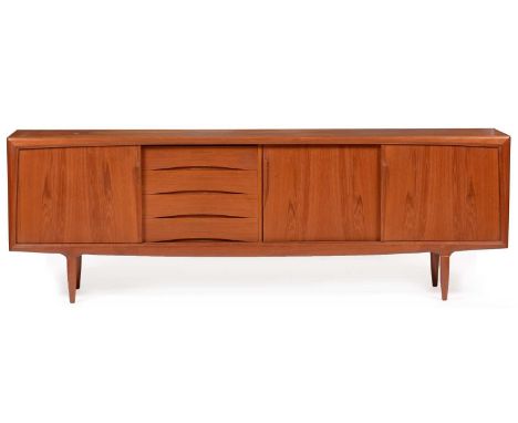 Gunni Omann for Axel Christensen Odder (ACO): a Danish teak long sideboard, with four drawers and three sliding doors, on tur