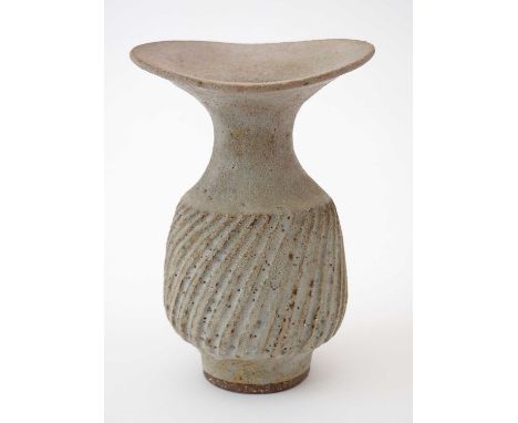 Lucie Rie (1902-1995). An olive coloured Stoneware Vase, with pitted 'volcanic' textured finish, wavy plate rim, waisted flat