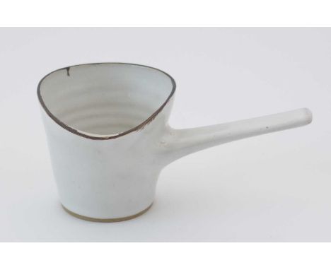 Lucie Rie (1902-1995). A single handled stoneware pouring vessel with slightly speckled white glaze, brown rim, unglazed foot