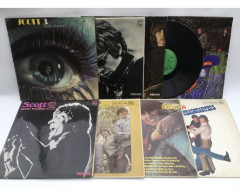 A collection of LPs by various artists including The Monkees, Elvis Presley, Scott Walker and others.