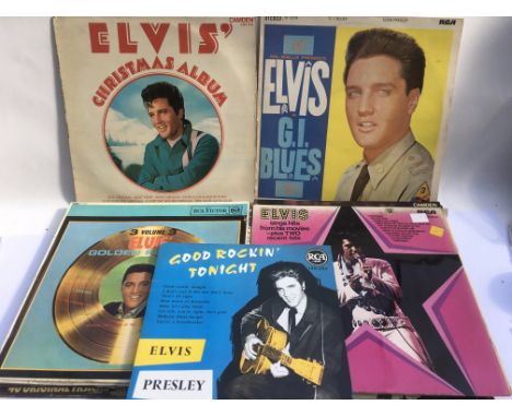 A record box containing a small collection of Elvis Presley LPs.