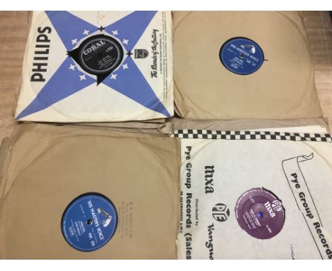 A collection of 78s including Elvis Presley, The Crickets and others.