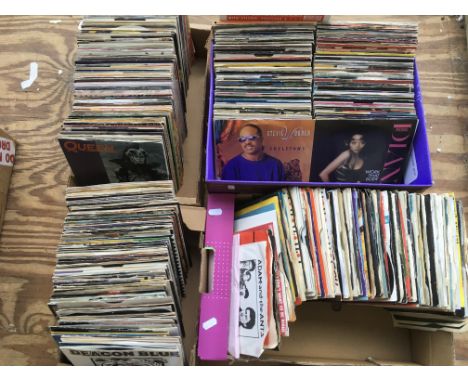 Four boxes of 7 inch singles by various artists from the 1970s and 80s including Queen, Elvis Costello, The Cult, Deep Purple