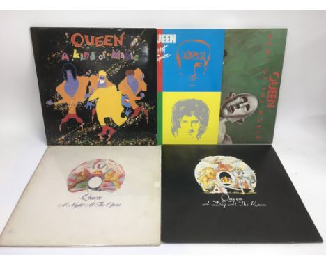 Five Queen LPs comprising 'A Day At The Races', 'A Night At The Opera', 'News Of The World', 'Hot Space' and 'A Kind Of Magic
