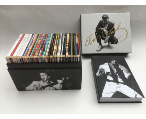 An Elvis Presley 'The Album Collection' 60CD box set with accompanying hardback book plus three other Elvis CD box sets (4).