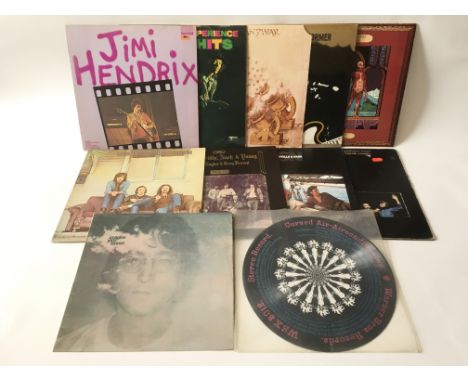 A record box containing a collection of LPs by various artists including John Lennon, Curved Air, Jimi Hendrix, CSNY, Family,