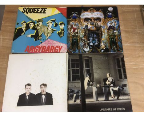 A collection of LPs by various artists including Michael Jackson, Squeeze, Pet Shop Boys and others.