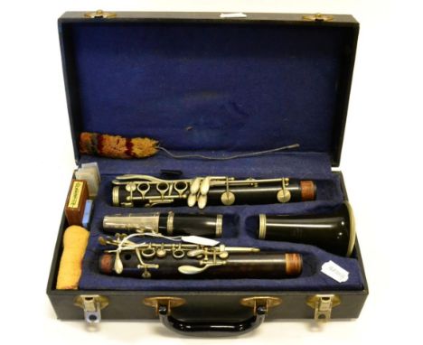 Clarinet wooden body and barrel with plastic bell, stamped 'Cabart a Paris', keywork unplated, serial number on both joints D