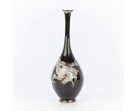 Antique Japanese cloisonne vase decorated with a serpentine white and blue dragon against a deep black ground. With an ovoid 
